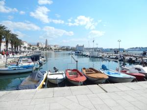 a group of boats are docked in a harbor at Apartments Emi in Split