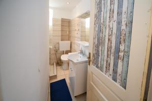 Koupelna v ubytování Apartments Bazilika