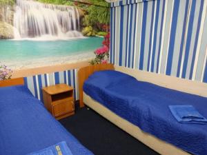 Кровать или кровати в номере Лотос