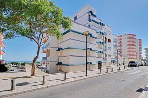 a building on the side of a street at Monte Gordo Beach 1 by Homing in Monte Gordo