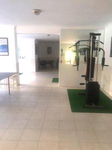 a large room with a gym with a treadmill at Gold Sun 4 in Mahmutlar