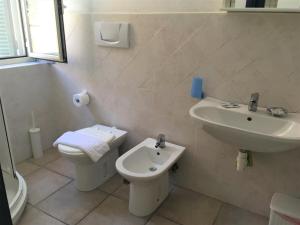 a bathroom with a toilet and a sink at Eolo Ventotene in Ventotene