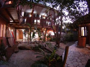 an outside view of a house with a building at Caza Floripa in Florianópolis +38 photos