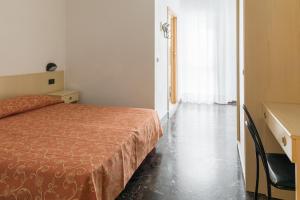 Voodi või voodid majutusasutuse Hotel Sabrina toas