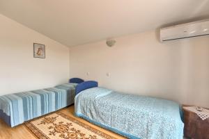 Llit o llits en una habitació de Haus Glavani