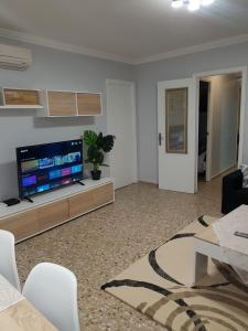 a living room with a large flat screen tv at 250 Playa in Puerto de Sagunto