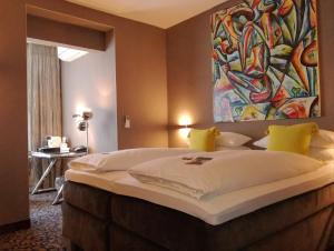 Postel nebo postele na pokoji v ubytování Top Hotel Krämer