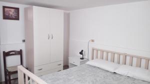 A bed or beds in a room at Villa Aquarium