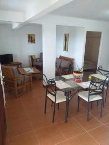 a dining room with a table and chairs at Ericka et François in Quartier Monplaisir