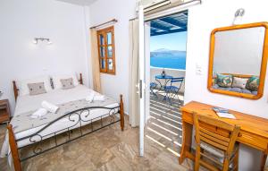 A bed or beds in a room at Stelios Rooms