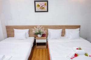 Postel nebo postele na pokoji v ubytování H79 HOTEL