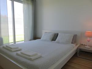 Krevet ili kreveti u jedinici u okviru objekta Alfarim House - close to Meco beach and Sesimbra