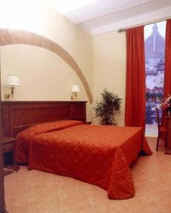 Postel nebo postele na pokoji v ubytování Hotel California