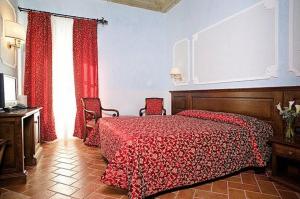 Postel nebo postele na pokoji v ubytování Hotel California