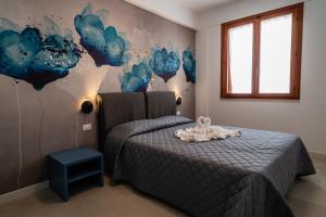 Cama o camas de una habitación en Residence Marinella