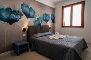 Ένα ή περισσότερα κρεβάτια σε δωμάτιο στο Residence Marinella