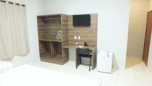 TV a/nebo společenská místnost v ubytování Gabirá Hotel
