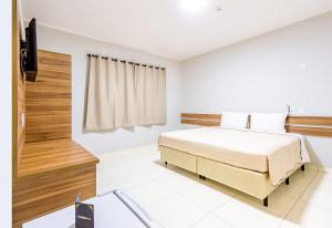 Postel nebo postele na pokoji v ubytování Gabirá Hotel
