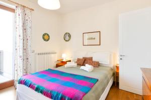 A bed or beds in a room at Flat in the heart of Pisa