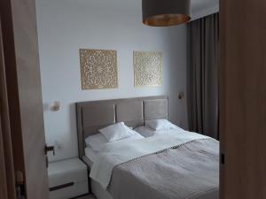 Postel nebo postele na pokoji v ubytování Regatowa Przystań