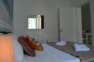 Postel nebo postele na pokoji v ubytování Apartment Bllaca + 30 fotografií