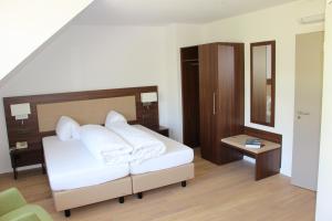 Letto o letti in una camera di Seehotel Delphin