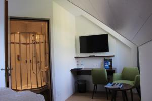 TV o dispositivi per l'intrattenimento presso Seehotel Delphin
