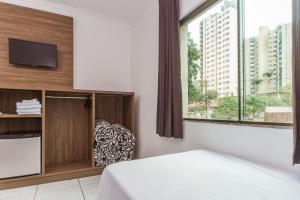 Postel nebo postele na pokoji v ubytování Hotel Holiday Foz