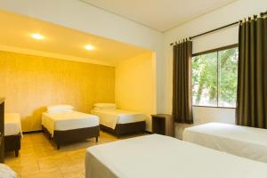 Postel nebo postele na pokoji v ubytování Hotel Holiday Foz