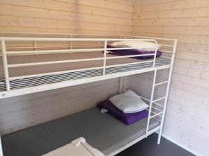 a room with two bunk beds in a room at Koljonvirta Camping in Iisalmi +13 photos