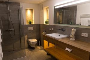 Koupelna v ubytování Wenkheimer Hof Ferienwohnung + 14 fotografií