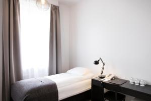 Postel nebo postele na pokoji v ubytování Fosshotel Rauðará