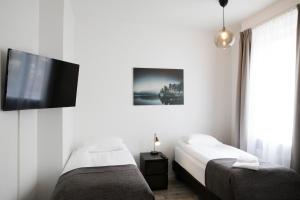 Postel nebo postele na pokoji v ubytování Fosshotel Rauðará
