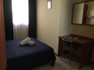 Posteľ alebo postele v izbe v ubytovaní Hotel Lido
