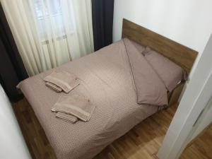 Postel nebo postele na pokoji v ubytování Tvoj Apartman