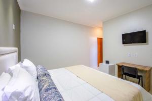 Postel nebo postele na pokoji v ubytování Gabirá Hotel