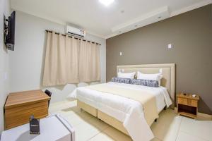 Postel nebo postele na pokoji v ubytování Gabirá Hotel
