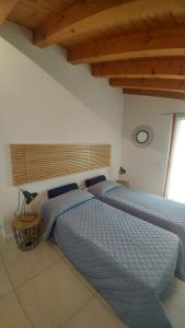 מיטה או מיטות בחדר ב-CASA GIORGIA - NEL CUORE DI VICENZA
