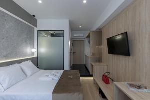 Posteľ alebo postele v izbe v ubytovaní Philosofia Athens Suites