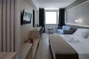Posteľ alebo postele v izbe v ubytovaní Philosofia Athens Suites