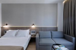 Posteľ alebo postele v izbe v ubytovaní Philosofia Athens Suites