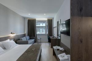 Posteľ alebo postele v izbe v ubytovaní Philosofia Athens Suites