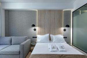 Posteľ alebo postele v izbe v ubytovaní Philosofia Athens Suites