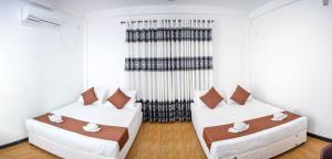 Postel nebo postele na pokoji v ubytování Lion Resort
