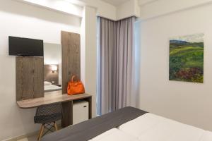 TV a/nebo společenská místnost v ubytování Hotel Metropol
