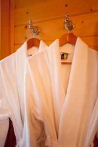 a group of white shirts hanging on a rack at Volcano Mist Cottage in Volcano