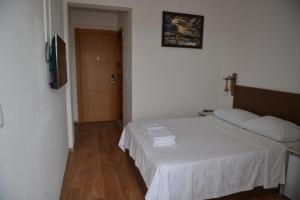 Ένα ή περισσότερα κρεβάτια σε δωμάτιο στο Double Comfort Otel