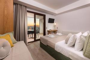 Кровать или кровати в номере Hotel Villa Natassa