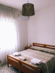 Postel nebo postele na pokoji v ubytování B&B dell'Amicizia