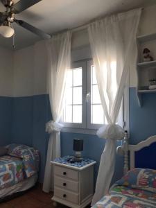 Ένα ή περισσότερα κρεβάτια σε δωμάτιο στο Villa Rocio, 1ª línea playa y Parque Natural - planta baja